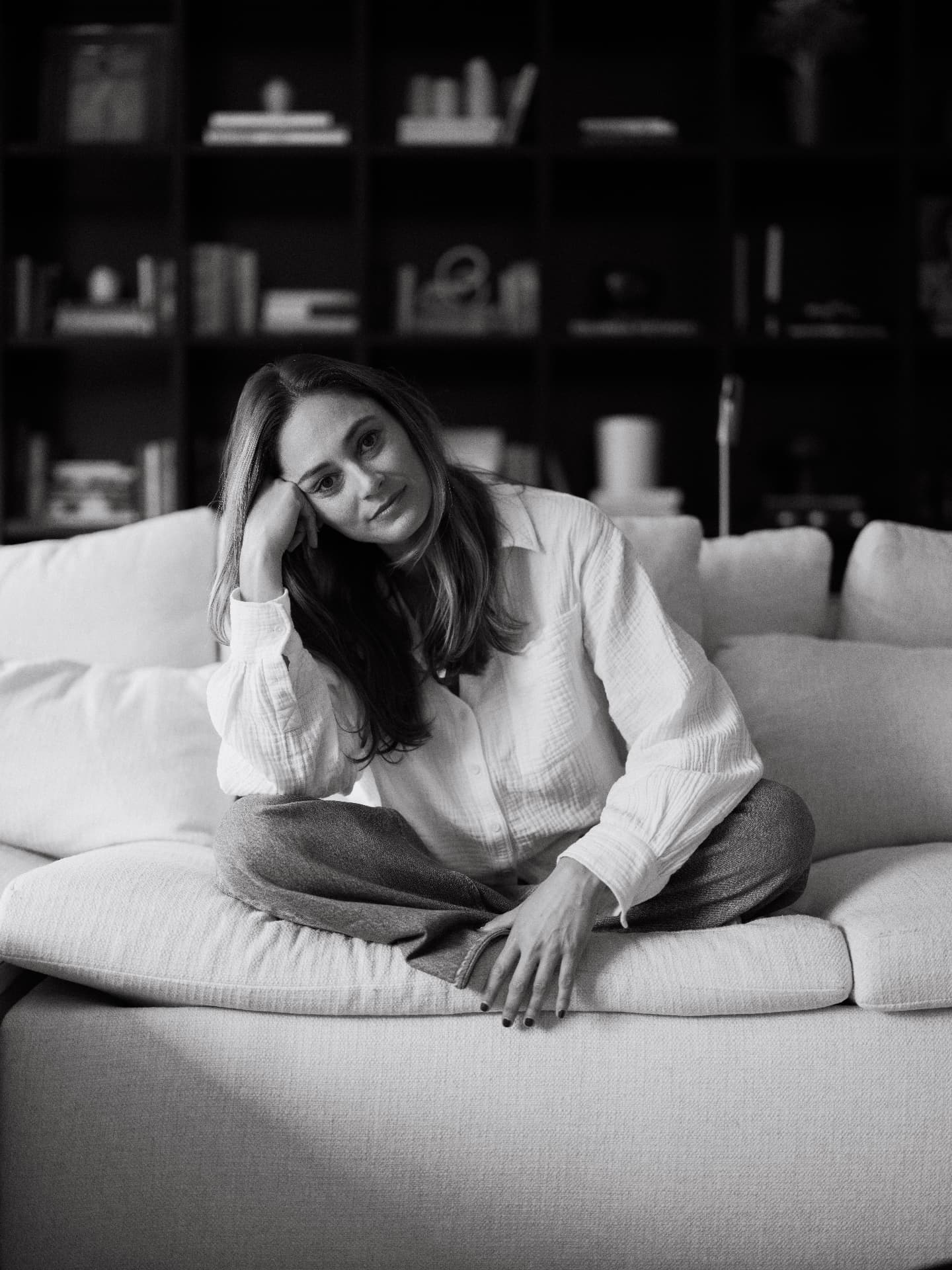 Liz Masucci seated on a sofa